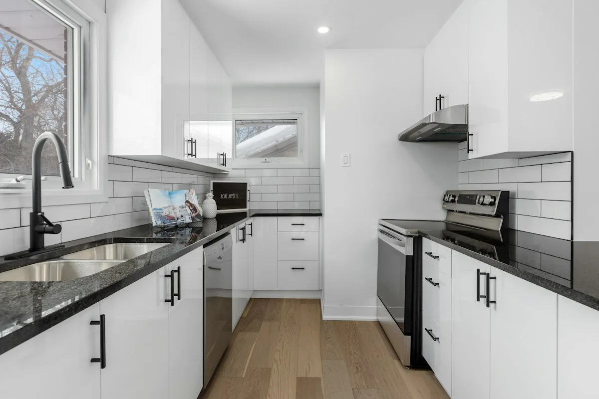 White kitchen with dark counters
