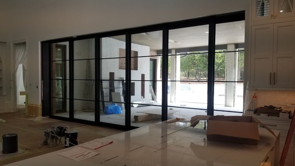 Large sliding patio doors opening onto an outdoor living space